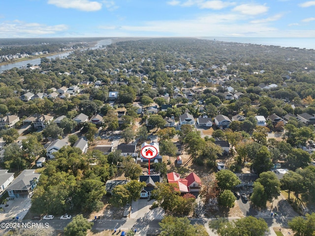 112 NE 28th St, Oak Island, NC 28465 - aerial perspective of suburban area featuring a nearby body of water