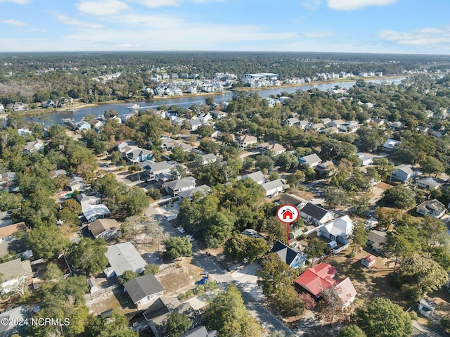 112 NE 28th St, Oak Island, NC 28465 - aerial overview of property's location featuring a nearby body of water and nearby suburban area