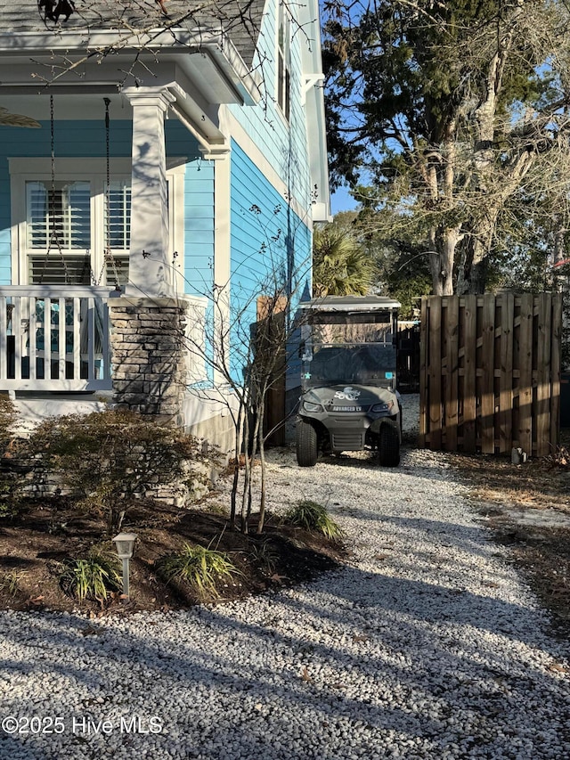 112 NE 28th St, Oak Island, NC 28465 - view of side of property featuring driveway