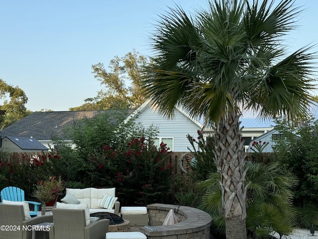 112 NE 28th St, Oak Island, NC 28465 - view of patio / terrace with an outdoor living space with a fire pit