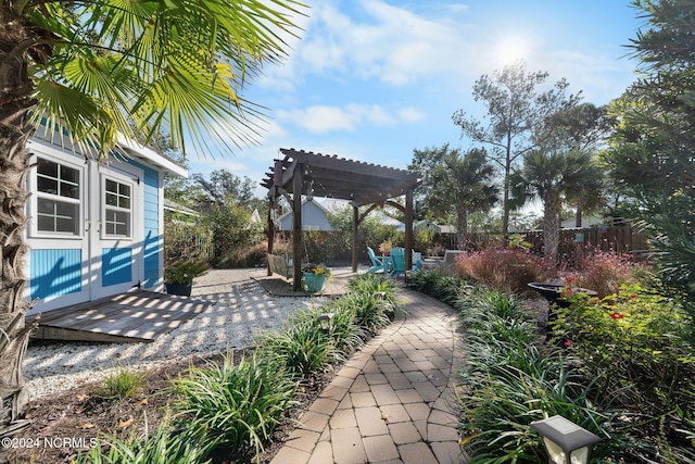112 NE 28th St, Oak Island, NC 28465 - view of patio / terrace with a pergola and an outdoor structure