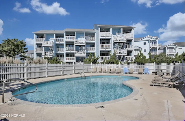 view of swimming pool featuring a patio area