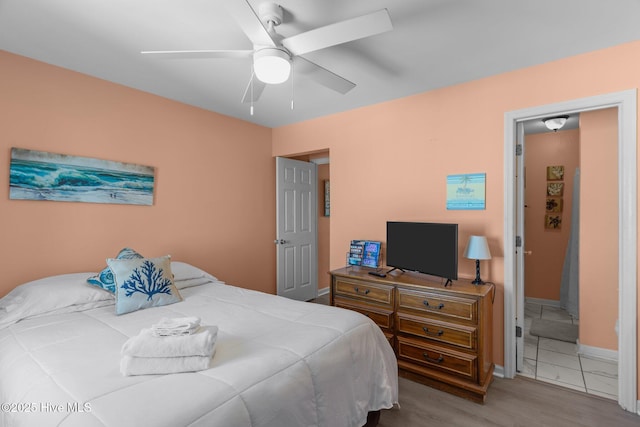 bedroom featuring ceiling fan and light wood-type flooring