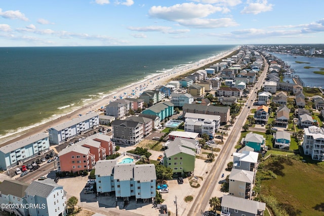 bird's eye view with a water view and a view of the beach