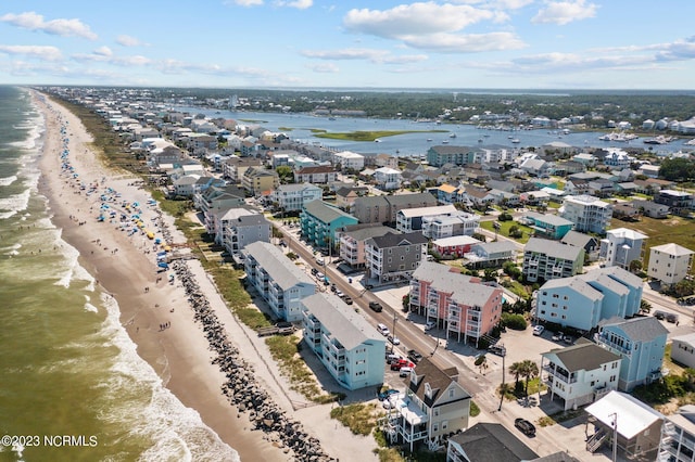 bird's eye view featuring a water view and a view of the beach