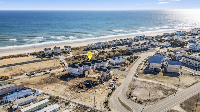 aerial view featuring a view of the beach and a water view