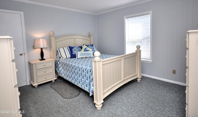 bedroom with dark colored carpet and ornamental molding