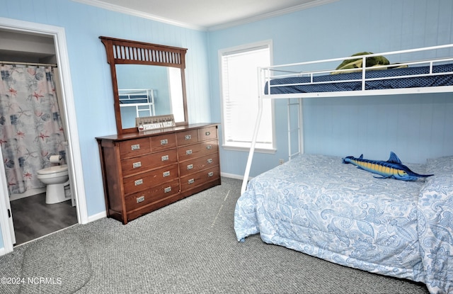 bedroom with carpet, ensuite bath, and ornamental molding