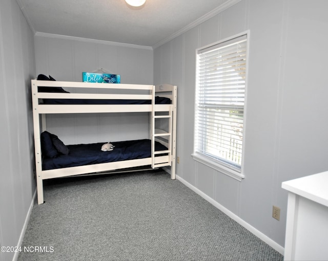 unfurnished bedroom with carpet floors and crown molding