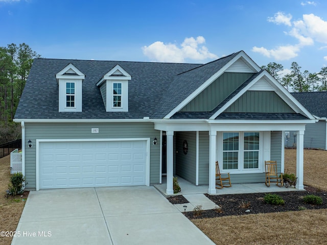 view of front of house featuring covered porch and a garage