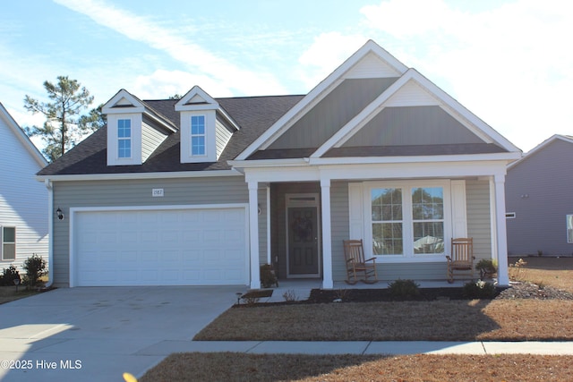 view of front facade featuring covered porch and a garage