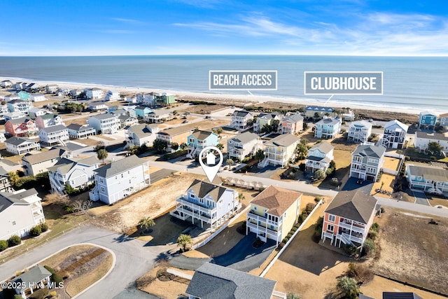 bird's eye view with a water view and a view of the beach