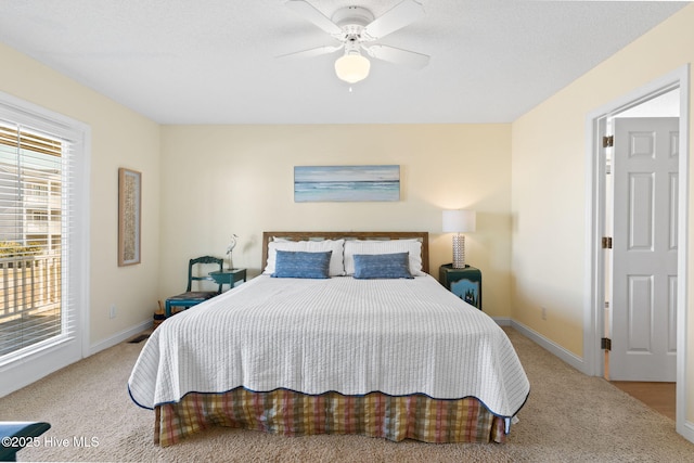 carpeted bedroom with access to outside and ceiling fan