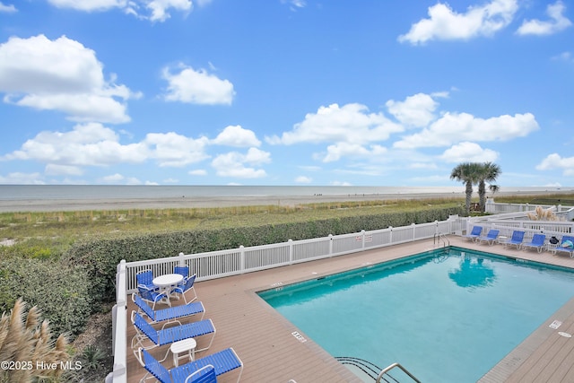 view of pool with a deck with water view