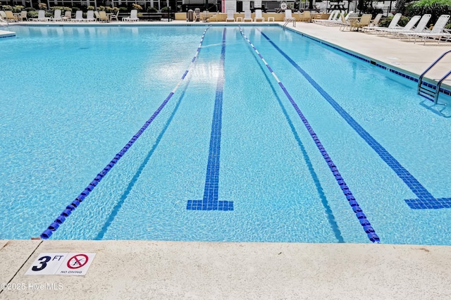 view of swimming pool with a patio area