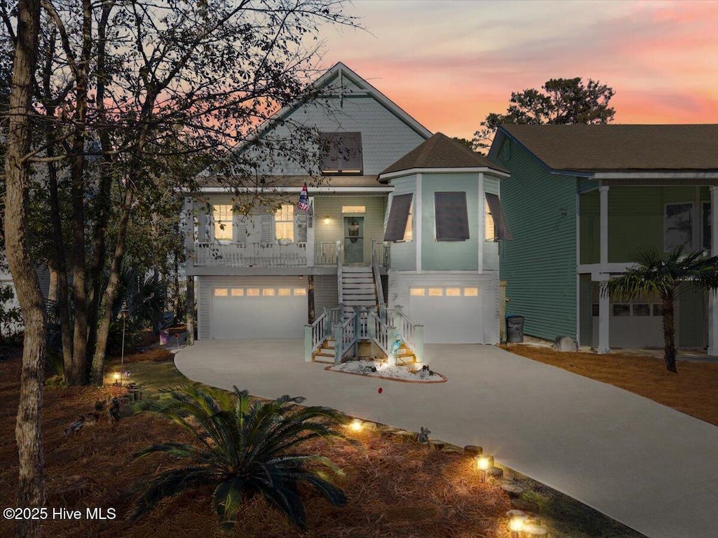 view of front of house featuring a garage and a porch