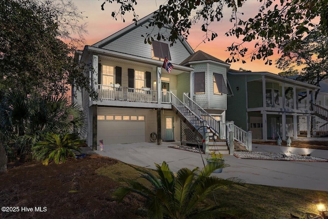 view of front of house with a garage and a porch