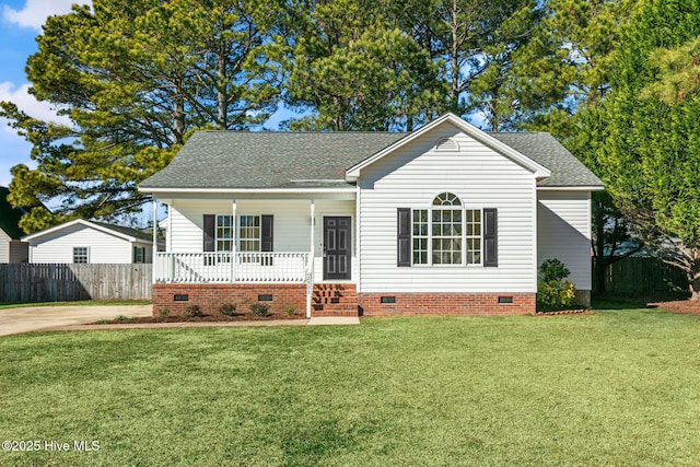 view of front of home with covered porch and a front lawn