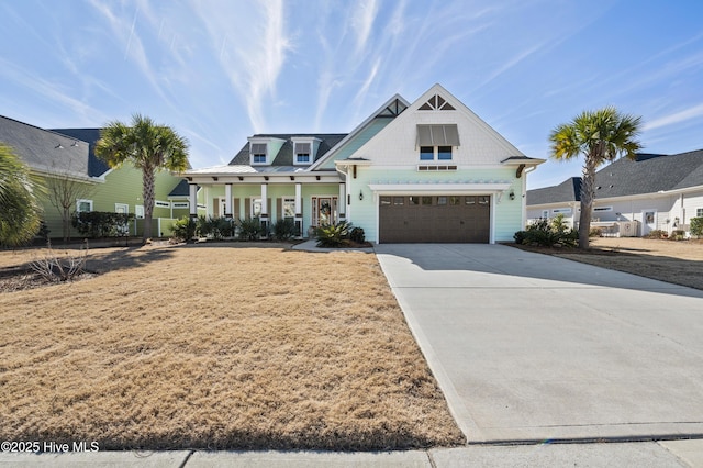 view of front of house featuring a porch and a garage