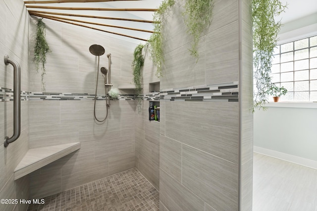 bathroom featuring a tile shower