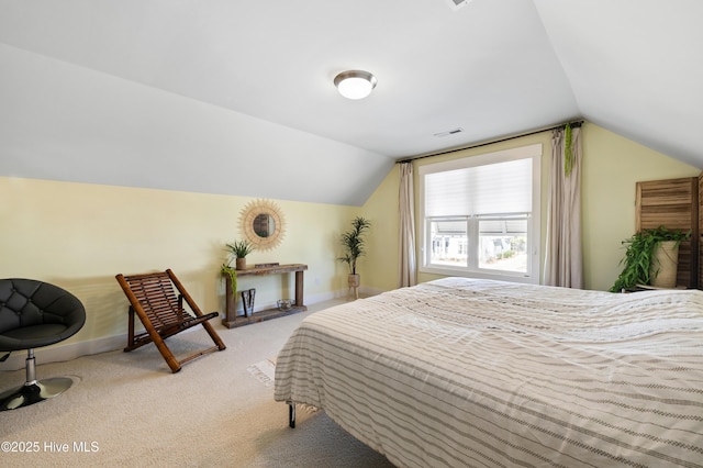 bedroom with light carpet and vaulted ceiling