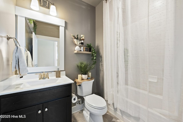 full bathroom with toilet, vanity, and shower / tub combo with curtain