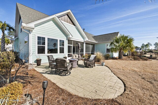 rear view of property with a patio area and outdoor lounge area