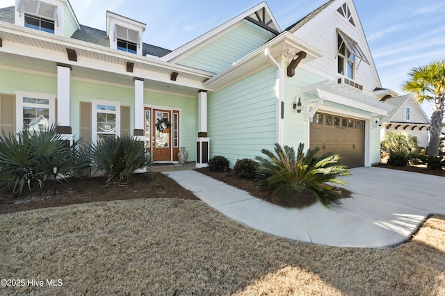 multi unit property featuring a garage and a porch