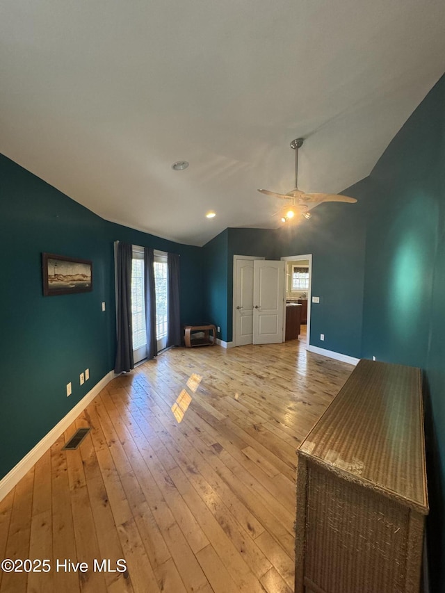 unfurnished living room with light hardwood / wood-style flooring and ceiling fan