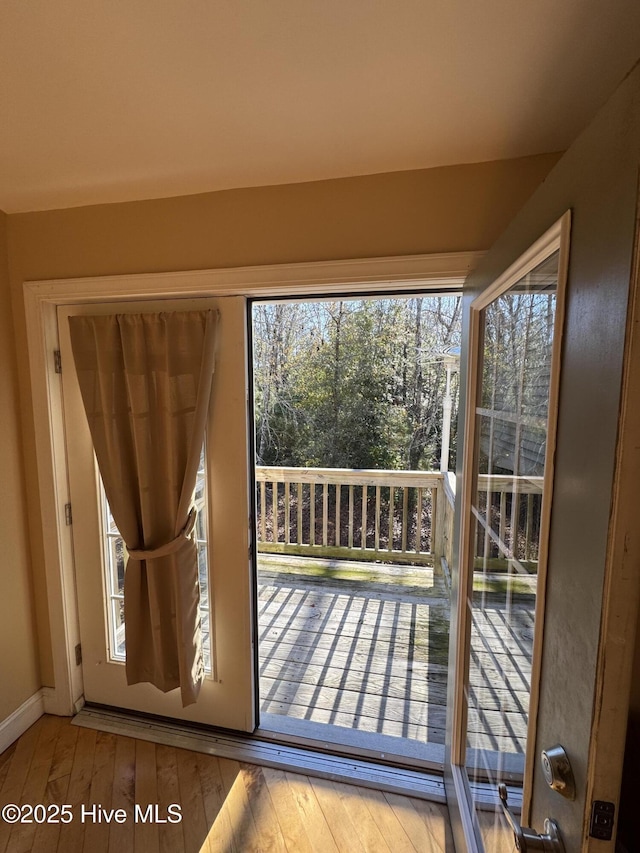 doorway to outside featuring hardwood / wood-style flooring