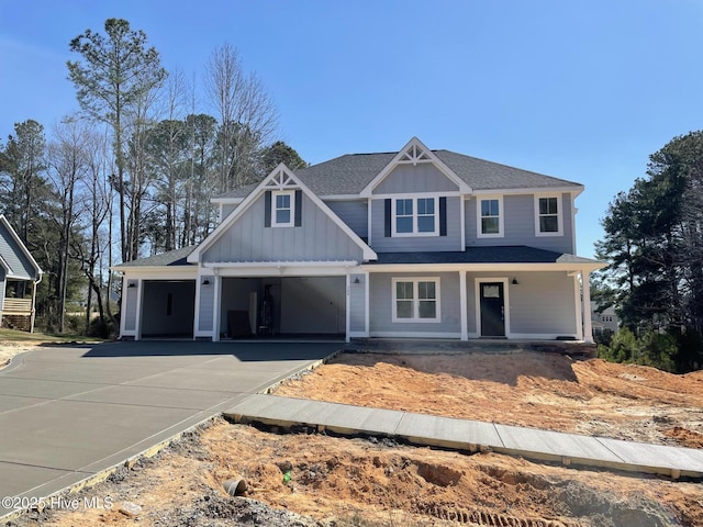 view of front facade featuring board and batten siding, a porch, concrete driveway, roof with shingles, and a garage