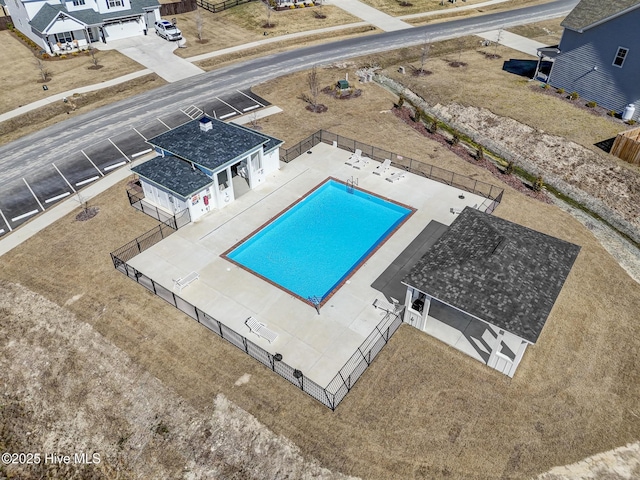 pool featuring a fenced backyard and a patio