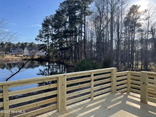 wooden deck featuring a water view