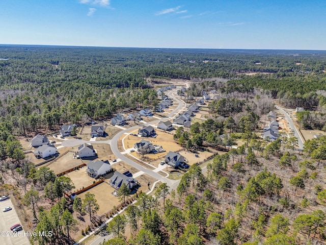 bird's eye view with a forest view