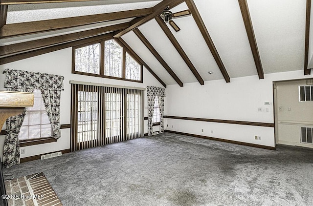 unfurnished living room with dark carpet, beam ceiling, high vaulted ceiling, and ceiling fan