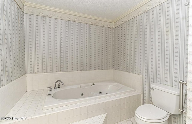 bathroom with a textured ceiling, crown molding, a relaxing tiled tub, tile patterned flooring, and toilet