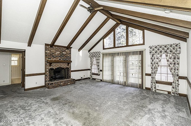 unfurnished living room featuring high vaulted ceiling, carpet flooring, ceiling fan, a fireplace, and beamed ceiling