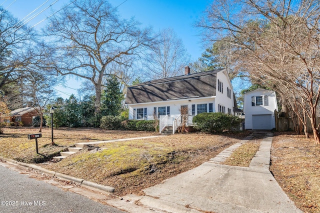 view of front of home with an outdoor structure and a garage