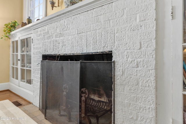 details featuring a fireplace and hardwood / wood-style floors