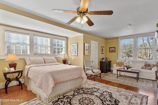 bedroom featuring wood-type flooring and ceiling fan