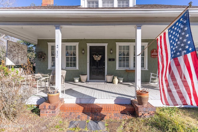 doorway to property with a porch