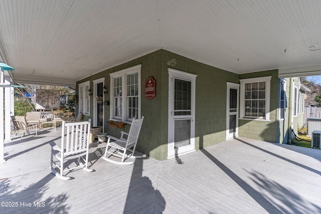 wooden terrace featuring covered porch