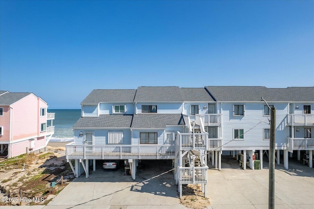 view of front of house with a water view