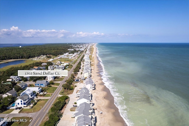 aerial view featuring a view of the beach and a water view