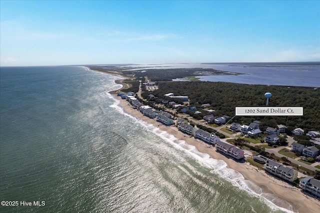 aerial view with a water view and a beach view