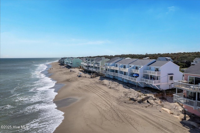 aerial view featuring a water view and a view of the beach