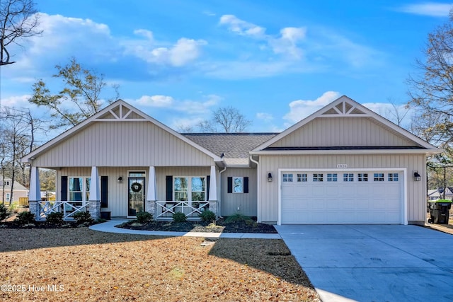 craftsman inspired home with a porch and a garage