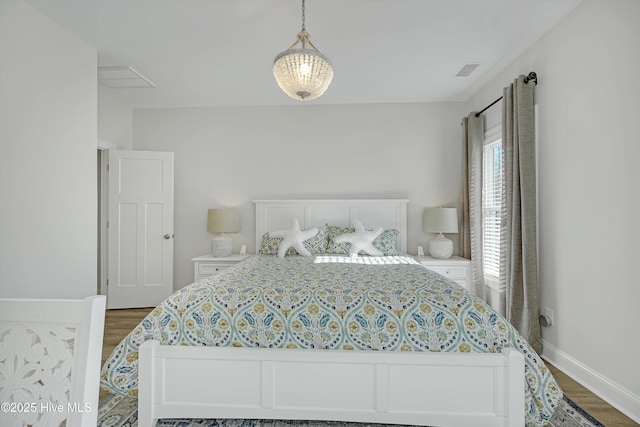 bedroom featuring dark hardwood / wood-style flooring