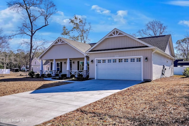 view of front of property featuring a garage and covered porch