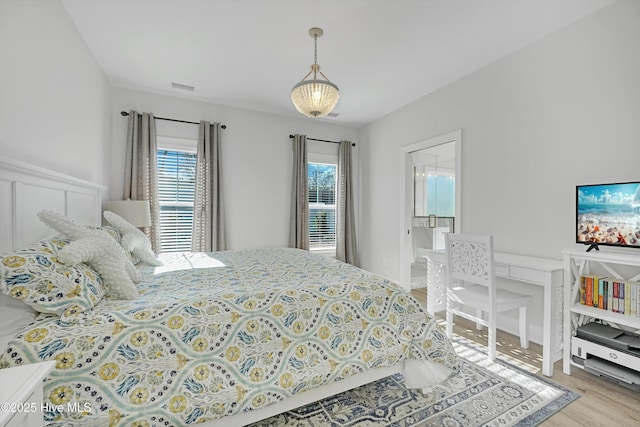 bedroom with light hardwood / wood-style floors